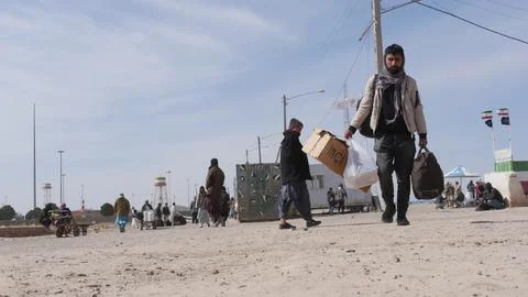 Afghans return from Iran through the Islam Qala border in Herat, Afghanistan - 1 Stock Photos