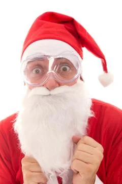 Afraid Santa Claus with safety glasses, concept protect and preserve the chri Stock Photos