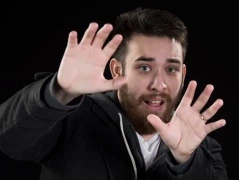 Afraid Young Man with Hands Up Stock Photos