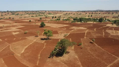Africa drought climate change - aerial view village community farm fields Stock Footage