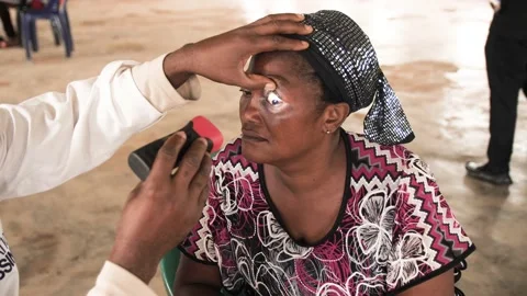 Africa eye surgeon checking and  treating patient eyes Stock-Footage 165438328