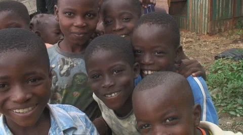 Africa: Laughing children peer at camera Stock Video Pond5
