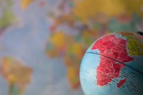 Africa map on a globe with earth map in the background. Stock Photos