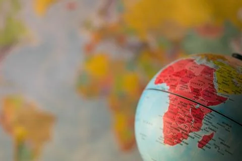 Africa map on a globe with earth map in the background. Stock Photos