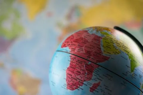 Africa map on a globe with earth map in the background. Stock Photos