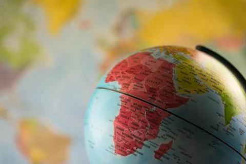 Africa map on a globe with earth map in the background. Stock Photos
