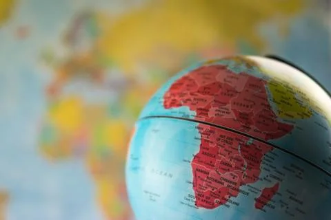 Africa map on a globe with earth map in the background. Stock Photos