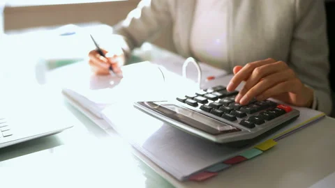 African Accountant Using Calculator Stock Footage 152461910