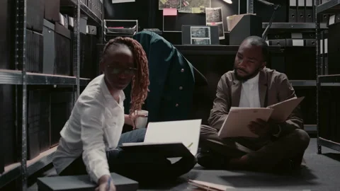 African american agents examining physical evidence Stock Footage 237479293