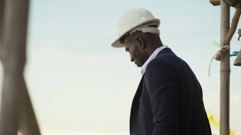 African american architect checking construction site outdoors at village . c Stock Footage