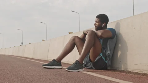 African-American Athlete Resting before Jogging Stock Footage 159785617