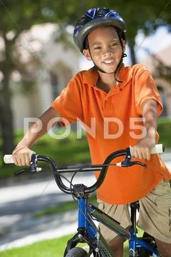 African american boy child riding bike Stock Photos