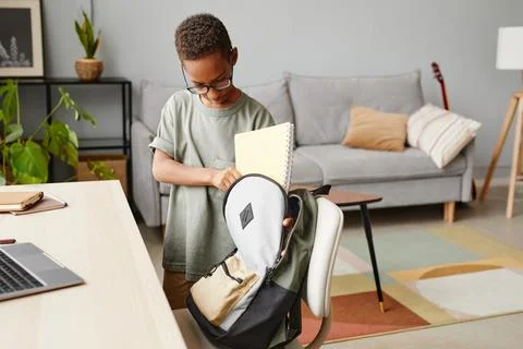 African American Boy Packing Backpack Stock Photos