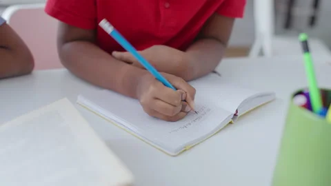 African American boy solving math problem, doing homework, distant learning Stock Footage 168423986