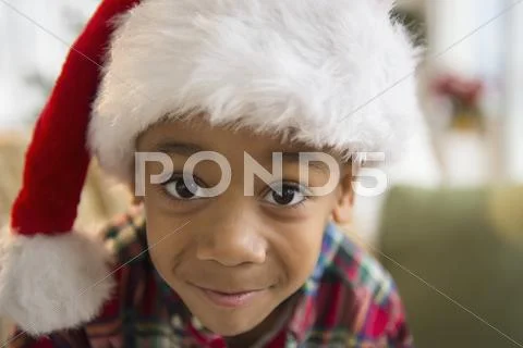 African American boy wearing Santa hat Stock Photos