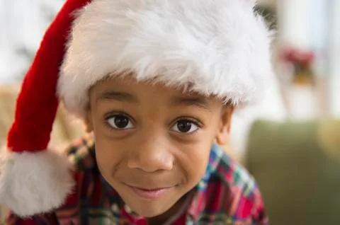 African American boy wearing Santa hat Stock Photos