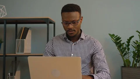 African american business man using laptop computer at the office. Black office Stock Footage 77423201
