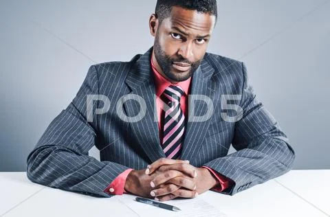 African american businessman signing a contract Stock Photos