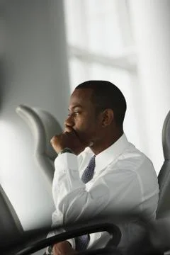 African American businessman sitting in chair Stock Photos