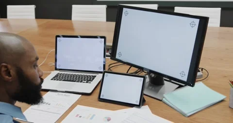 African american businessman using computer, tablet and laptop, copy space on Stock Footage 341319735