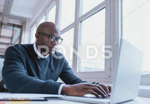 African American Businessman Working On His Laptop
