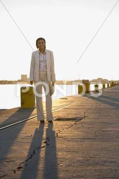 African American businesswoman on commercial pier Stock Photos