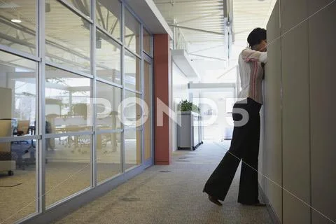 African american businesswoman leaning over cubicle wall Stock Photos