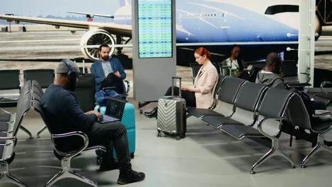 African american casual man using AI neural networks in airport lounge Stock Footage 339643103