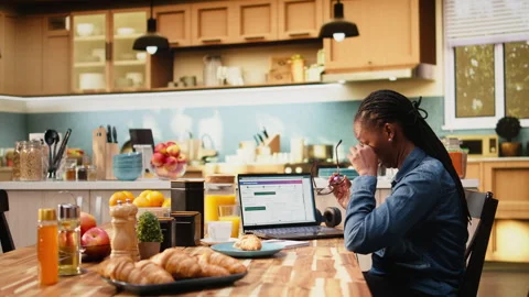 African american client checking dispatch via tracking number on software Stock Footage 344245092