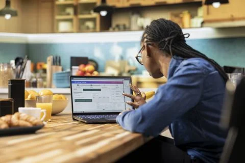 African american client checking dispatch via tracking number on software Stock Photos