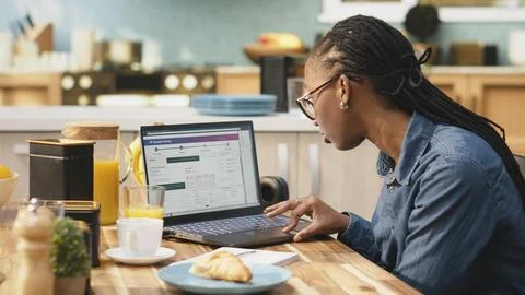 African american client checking dispatch via tracking number on software Fotos Stock
