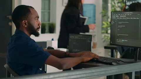 African american coder developing app interface with html code and script Stock Footage 227612256