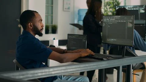 African american coder developing app interface with html code and script Stock Photos