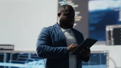 African american coder expert immersing in software development Stock Footage 312300476