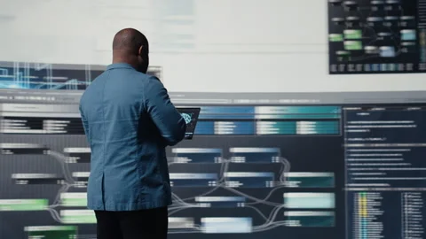 African american coder expert immersing in software development Stock Footage 312478797