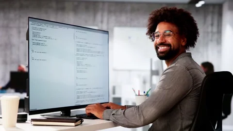 African American Coder Using Computer At Desk Stock Footage 290165503