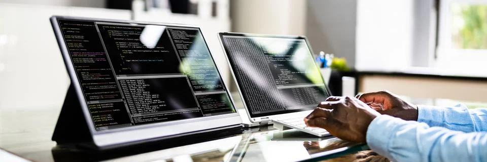 African American Coder Using Computer At Desk Stock Photos
