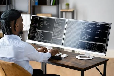 African American Coder Using Computer At Desk Foto stock