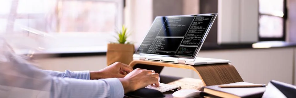 African American Coder Using Computer At Desk 스톡 사진