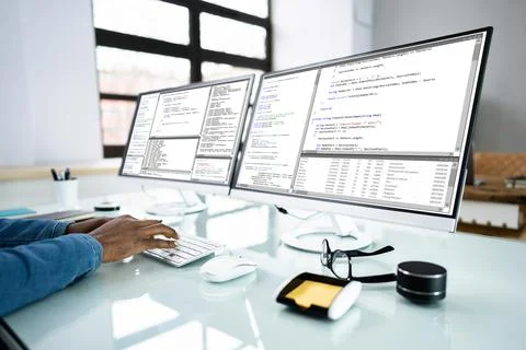 African American Coder Using Computer At Desk Stock Photos