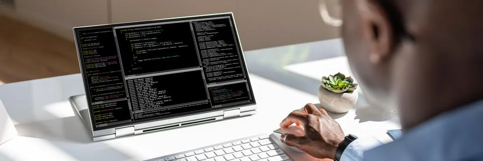 African American Coder Using Computer At Desk Stock Photos