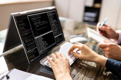 African American Coder Using Computer At Desk 写真素材