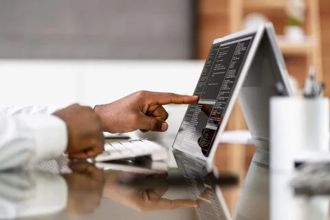African American Coder Using Computer At Desk 写真素材