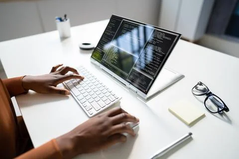 African American Coder Using Computer At Desk 스톡 사진