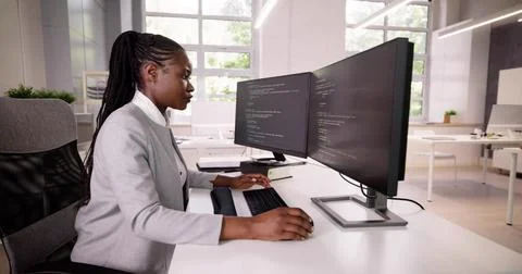 African American Coder Using Computer At Desk Stock Photos