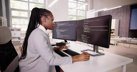 African American Coder Using Computer At Desk 스톡 사진