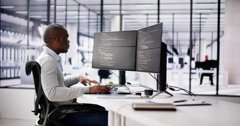 African American Coder Using Computer At Desk 스톡 사진