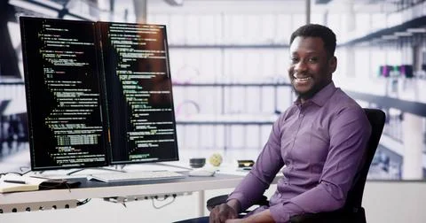 African American Coder Using Computer At Desk. Web Developer Foto stock