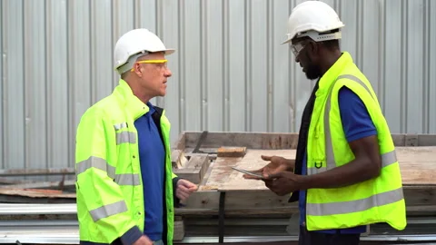 African american Construction manager and senior engineer worker discussing w Stock Footage 154849587