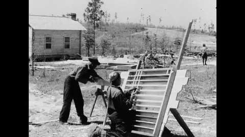 African American Construction Workers Building Wooden Cabin Stock Footage 114370281